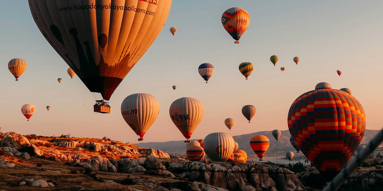 Hot air balloons flying in the valley