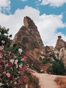 Best time to visit Cappadocia — Uçhisar Castle with wildflowers in April
